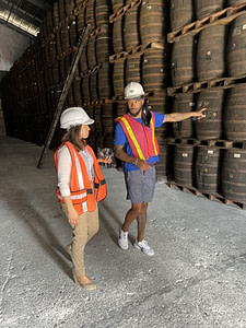 Nolan Carroll and Jessica with Yolo Rum barrels