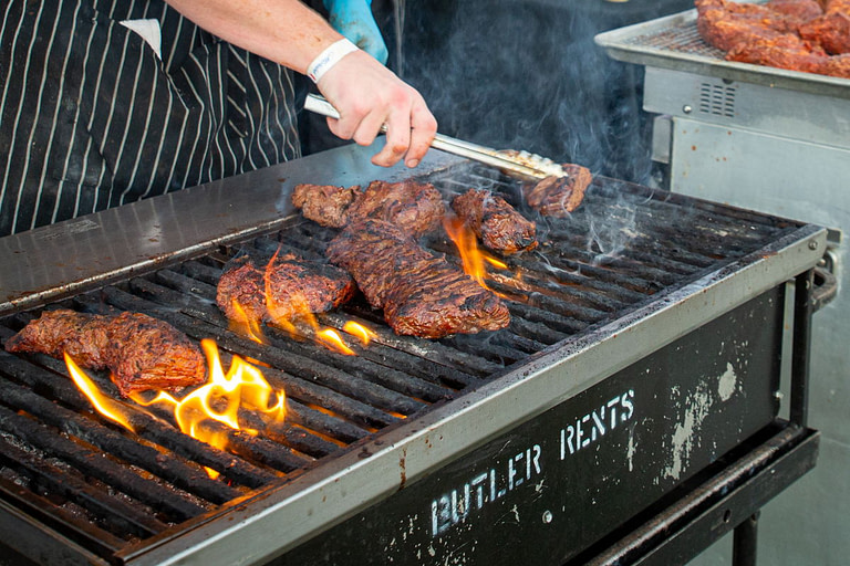 steak on grill at Rare Denver